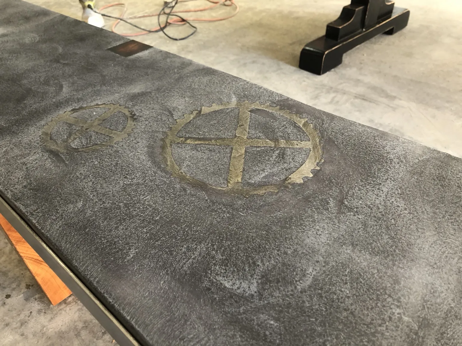 Custom concrete artwork and specialty detail by Coastal Concrete Studio
